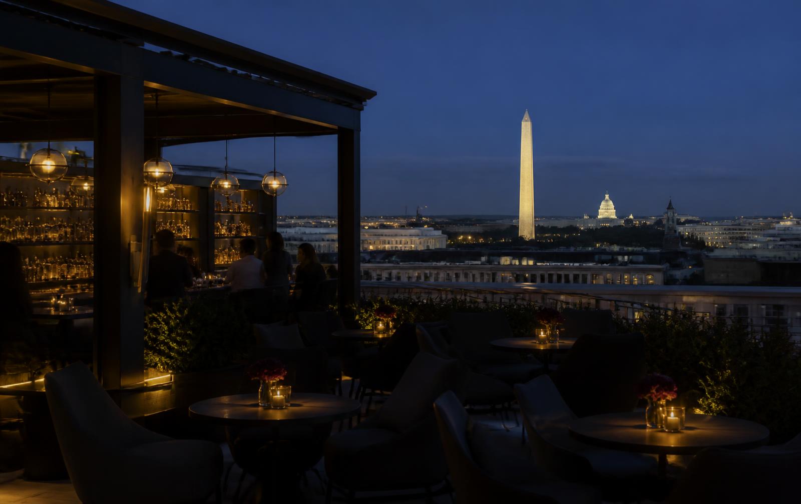 Rooftop terrace at dusk overlooking the Washington, DC skyline